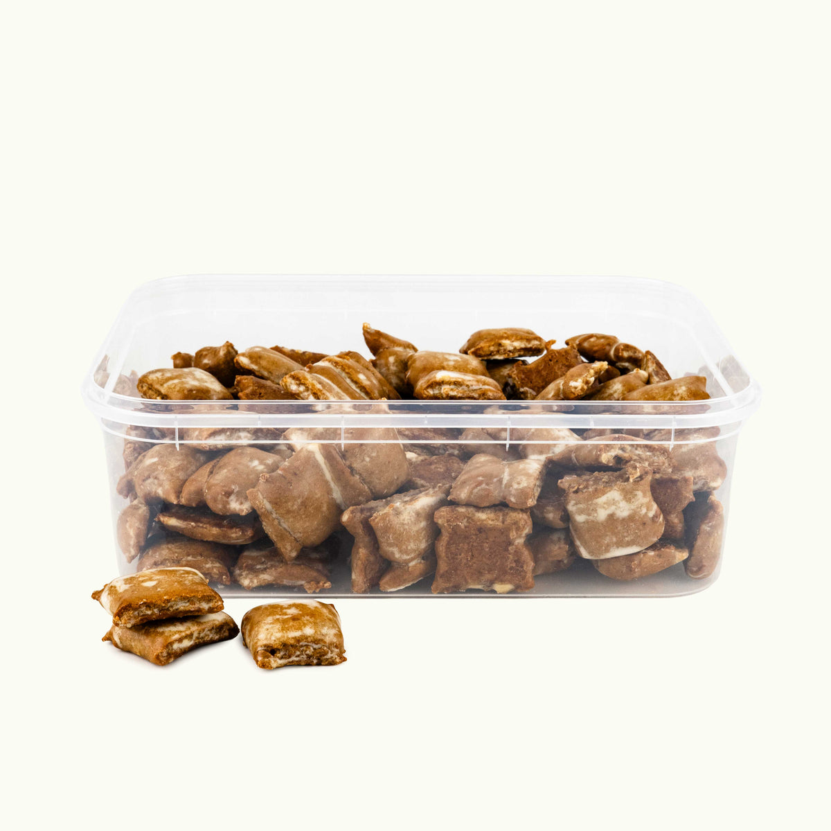 Transparente Box mit kleinen, glasierten Orangen Lebkuchen.