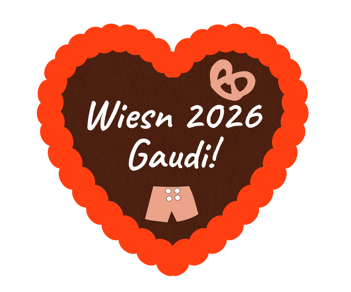 Lebkuchenherz mit orangefarbener Umrandung aus Zuckerguss, Aufdruck „Wiesen 2026 Gaudi!“ und Herzmotiv