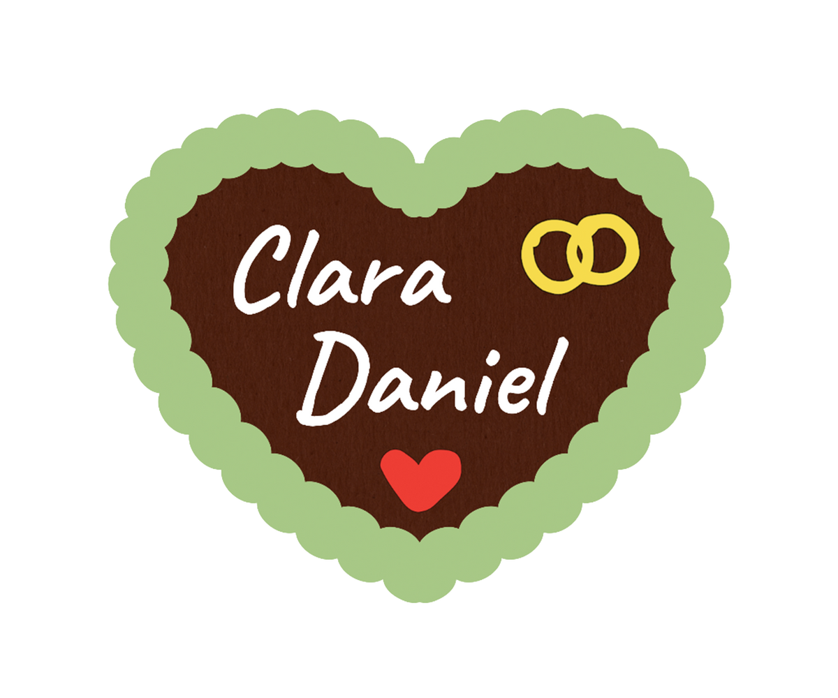 Lebkuchenherz mit grünem Rand aus Zuckerguss, „Clara“ & „Daniel“, goldenen Ringen und rotem Herz dekoriert